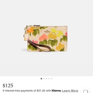 NWOT. Coach Floral Wristlet